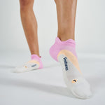 Feetures Elite Light Cushion Tab socks in White Rose colorway on model feet