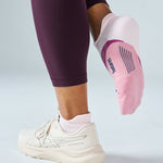 Feetures Elite Light Cushion Tab sock in Lilac Breeze pink worn with white ASICS sneakers