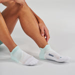 Feetures Elite Light Cushion Tab socks in Mint Chip worn by model on clean background