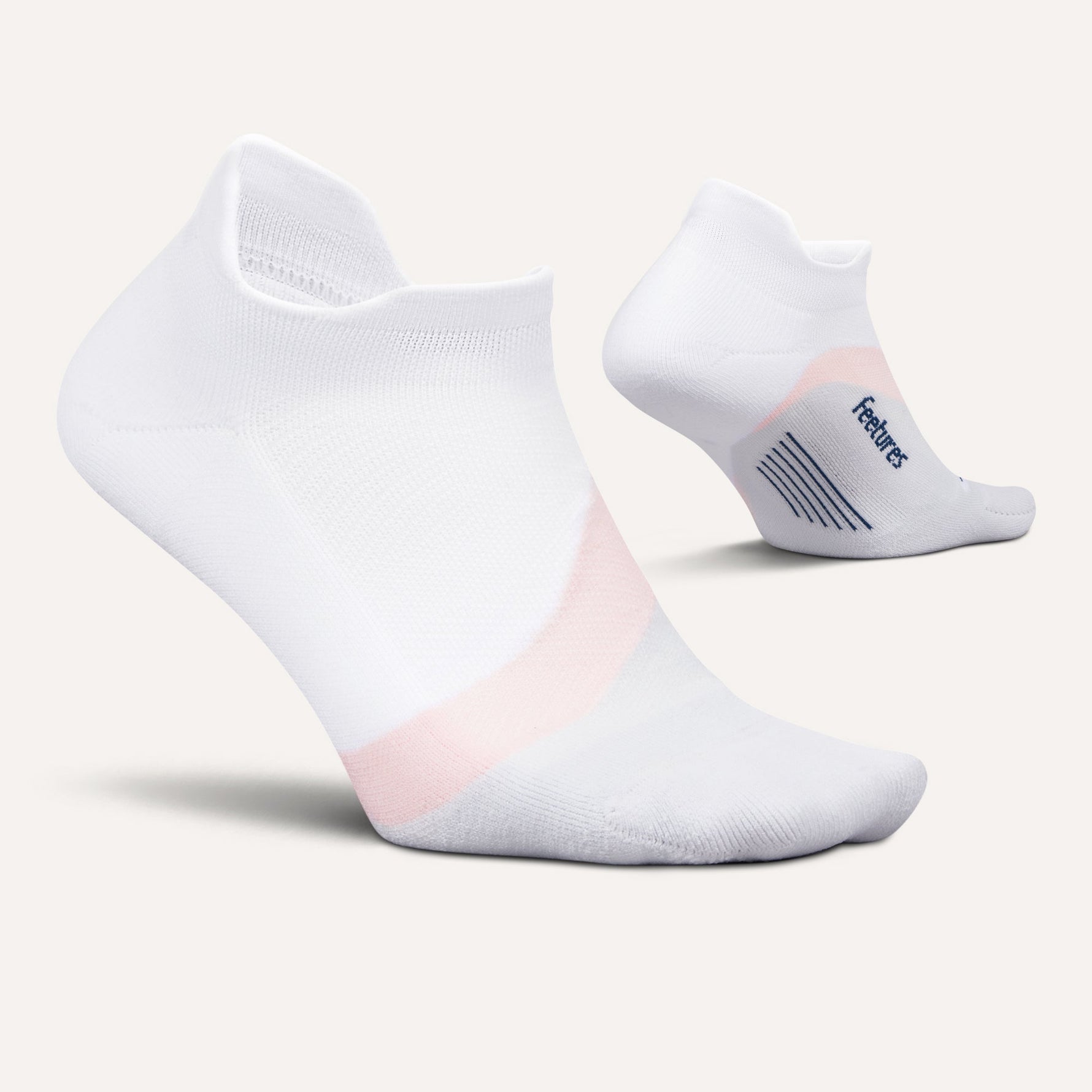 Feetures Elite Light Cushion Tab socks in white with rose pink accent, shown from two angles