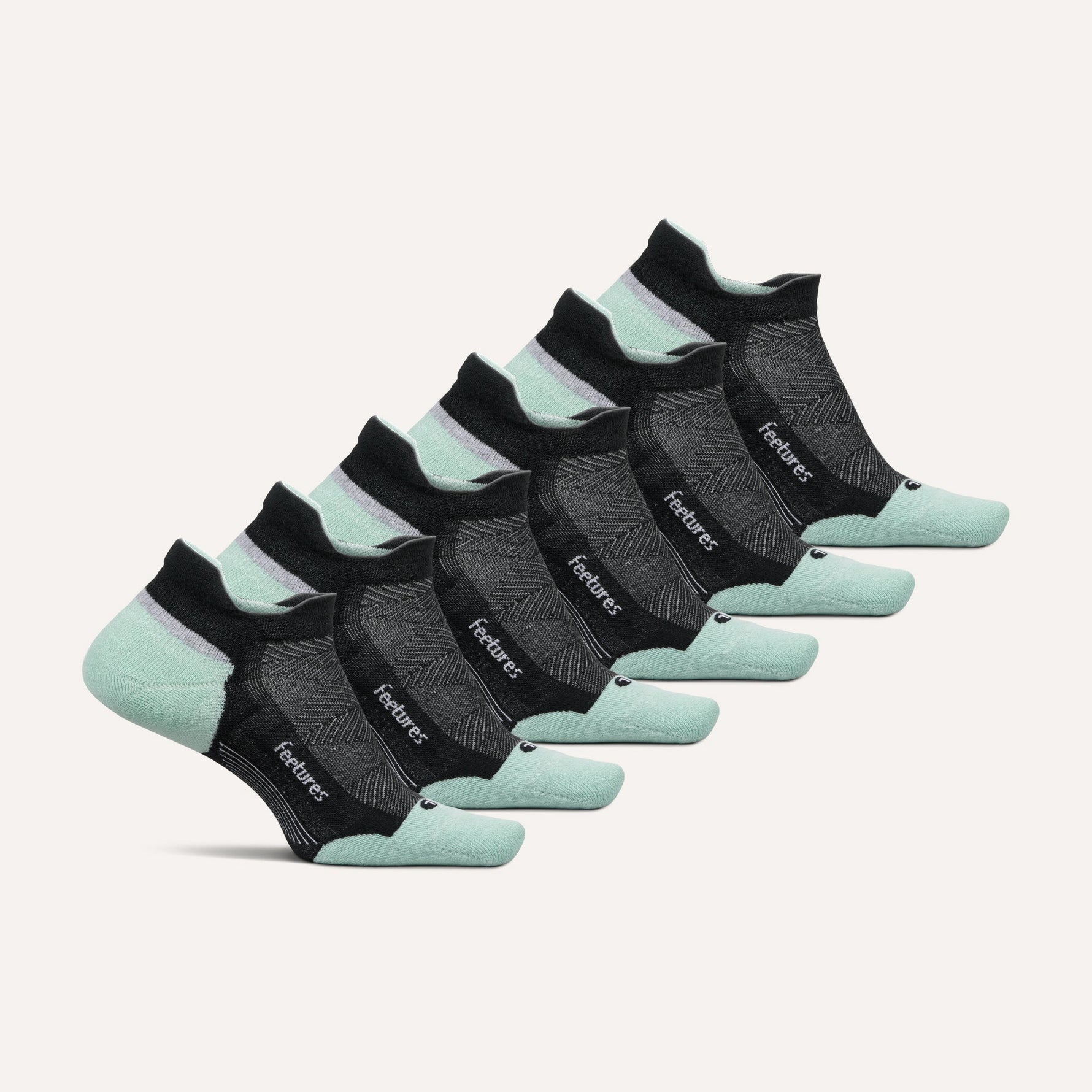 Feetures Elite Max Cushion Tab socks in black and mint green, six-pack set