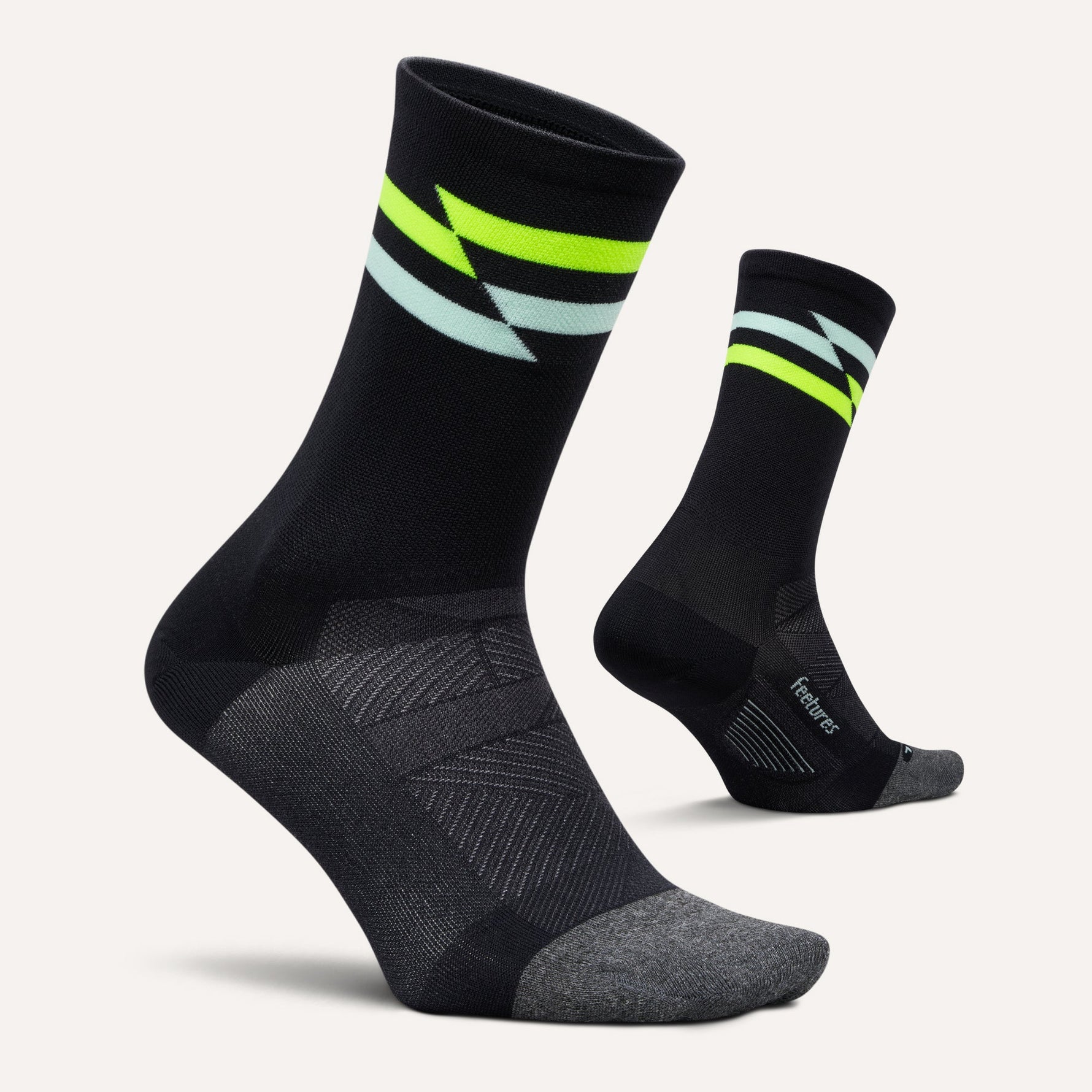 Feetures Elite Ultra Light Mini Crew socks in black with neon yellow and mint stripes