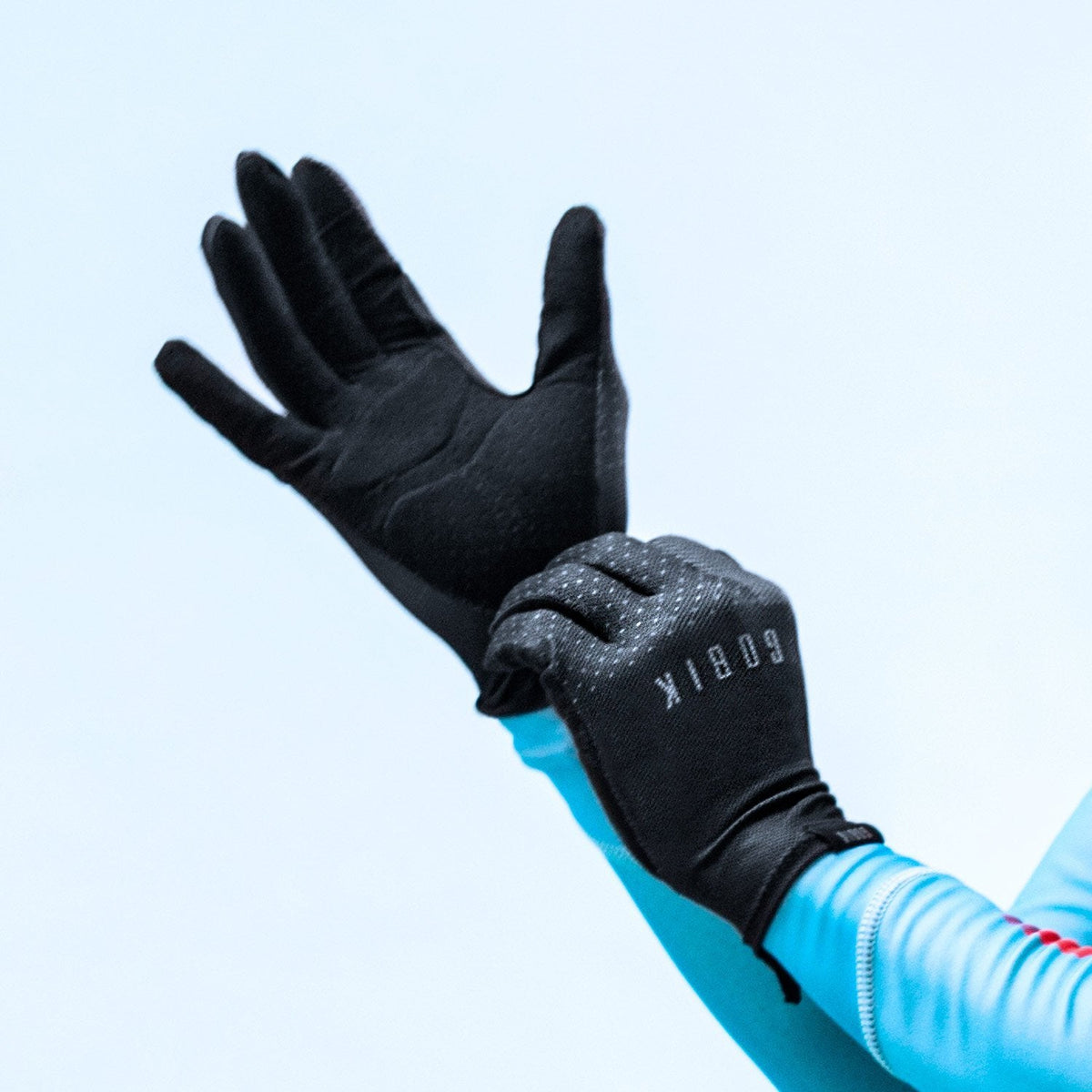 Gobik Eagle long finger cycling gloves in black shown being worn on hand