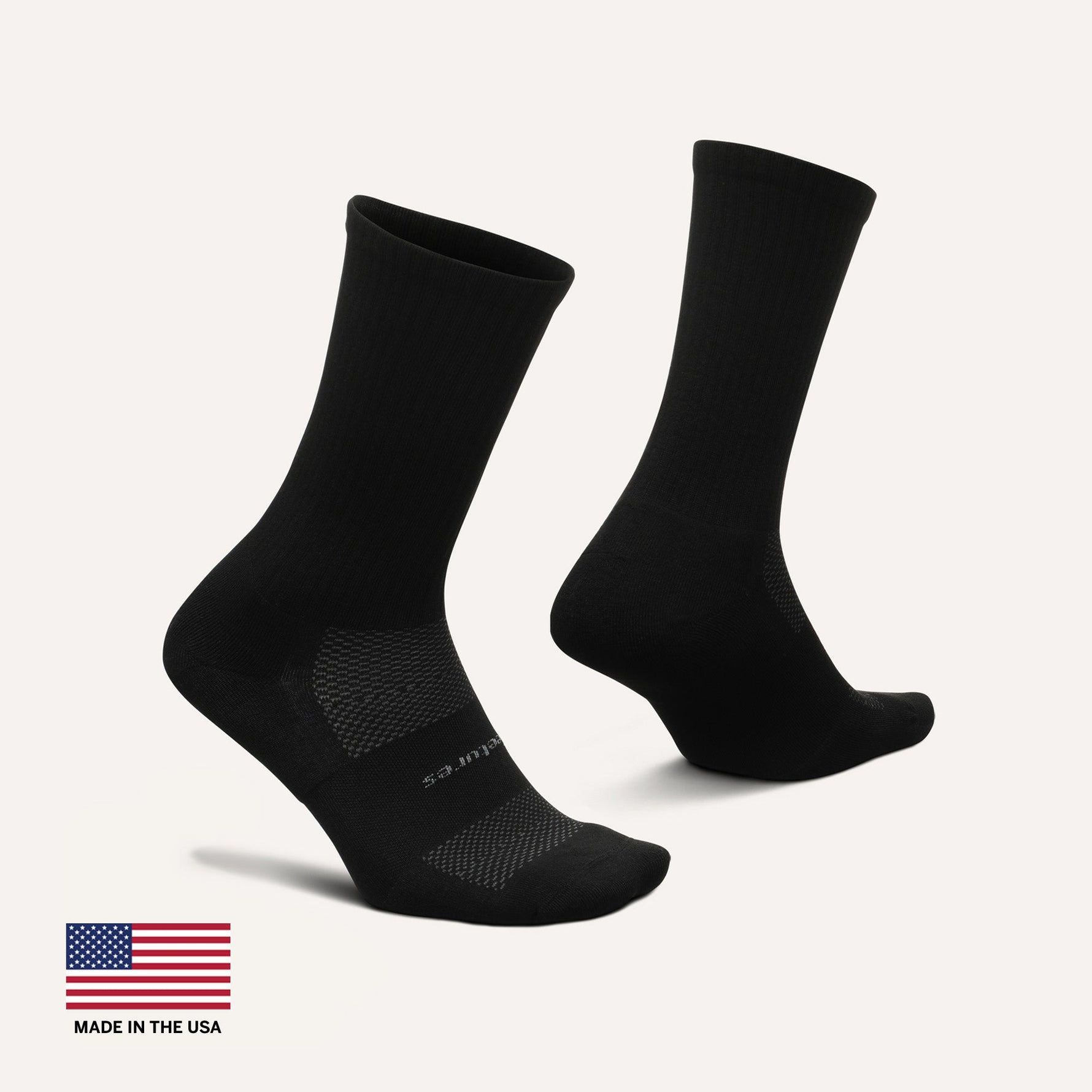 Feetures High Performance Max Cushion Crew socks in black, front and back view