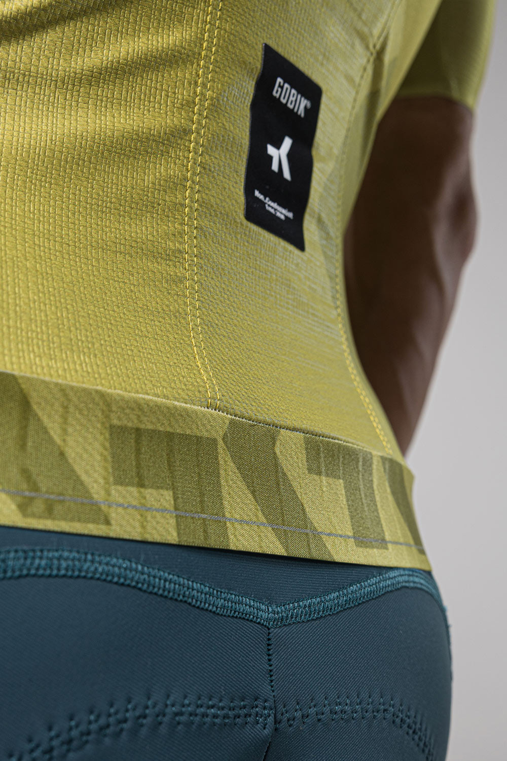 Gobik Attitude 2.0 cycling jersey in split green colorway with yellow-green and teal sections