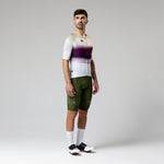 Male cyclist wearing Gobik CX-Pro jersey in Teaberry colorway with olive bib shorts