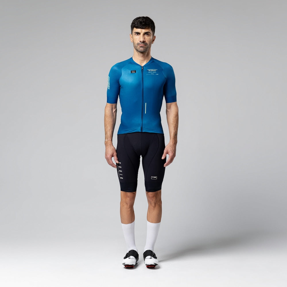 Man wearing blue Gobik CX 2.0 Pro cycling jersey with black shorts