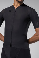 Black Gobik Phantom cycling jersey with textured fabric and front zipper on model