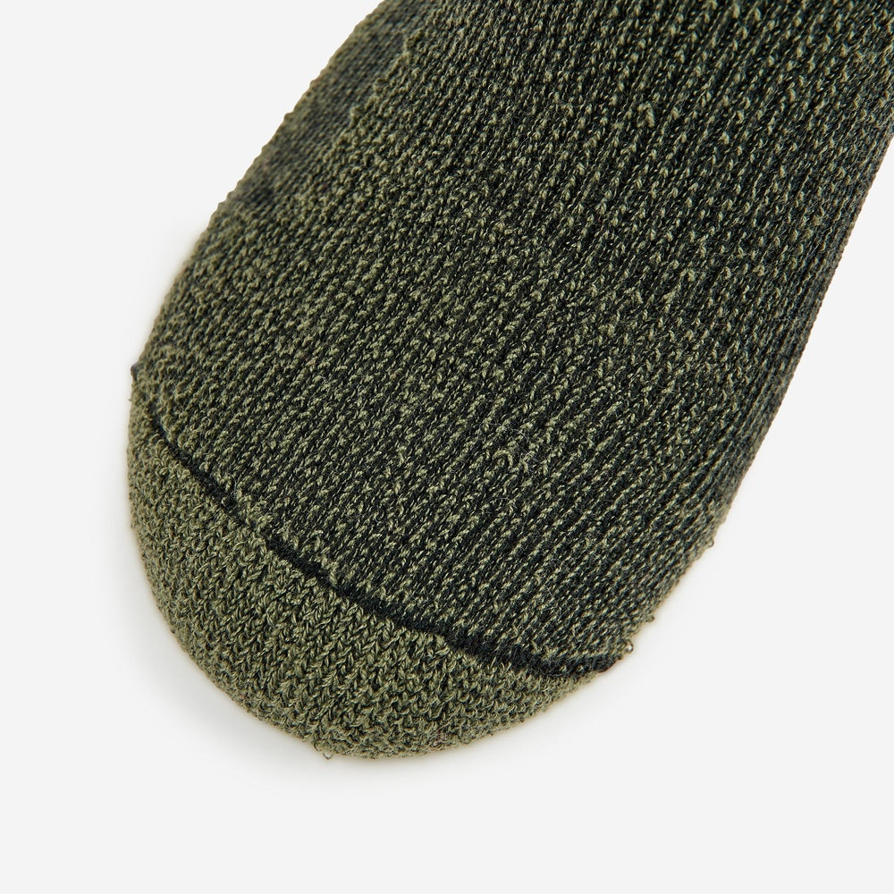 Thorlos hiking crew sock toe box in forest green marl knit fabric closeup