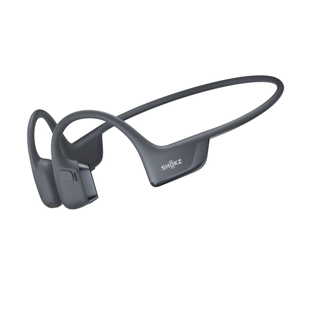 Gray Shokz bone conduction headphones with wraparound design on white background