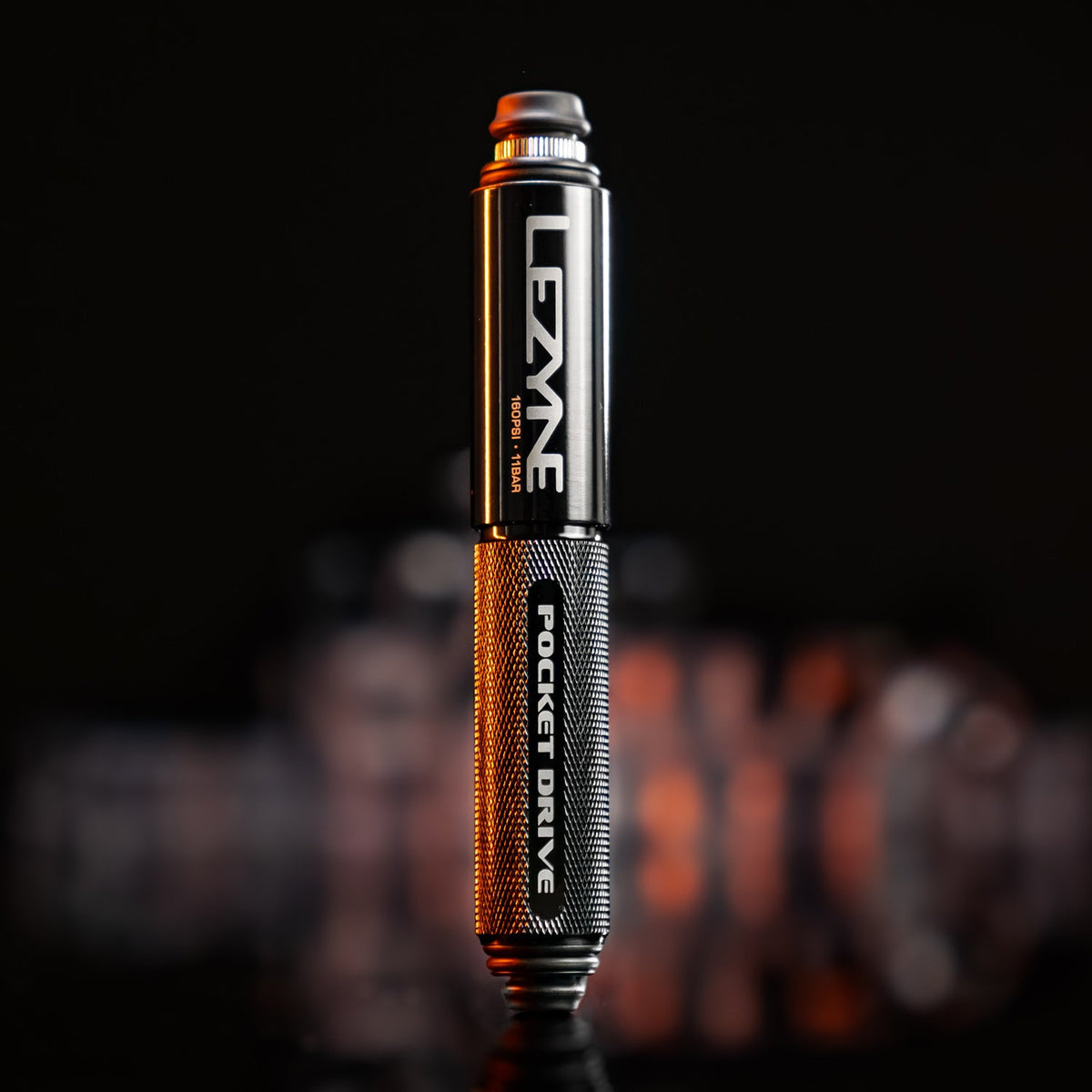 Lezyne Pocket Drive mini bike pump in black and bronze aluminum finish, 180PSI rated