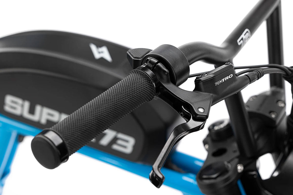 Close-up of Super73 R Brooklyn e-bike handlebar with Tektro brake lever and textured grip