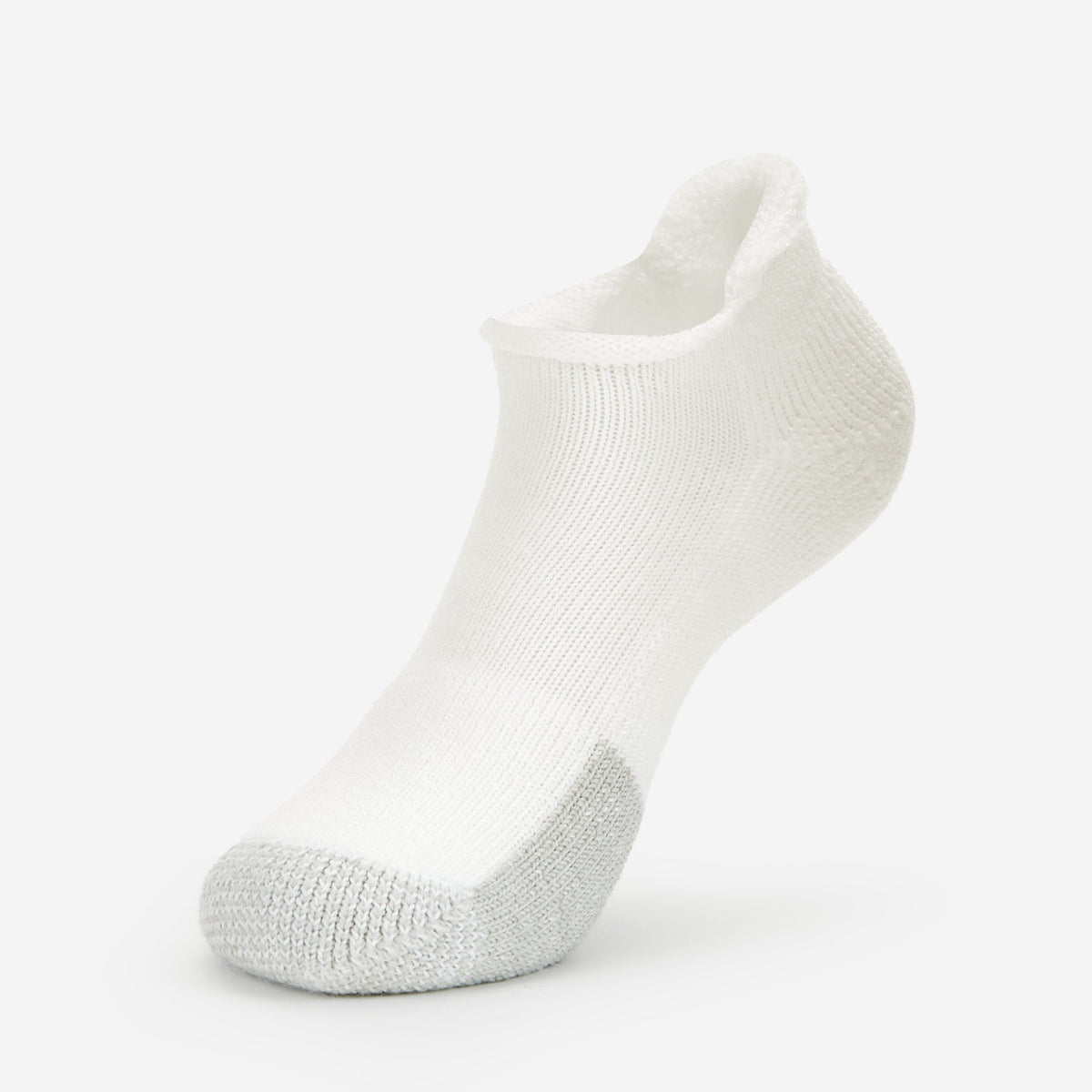 Thorlos white ankle tennis sock with gray toe cushioning on clean background