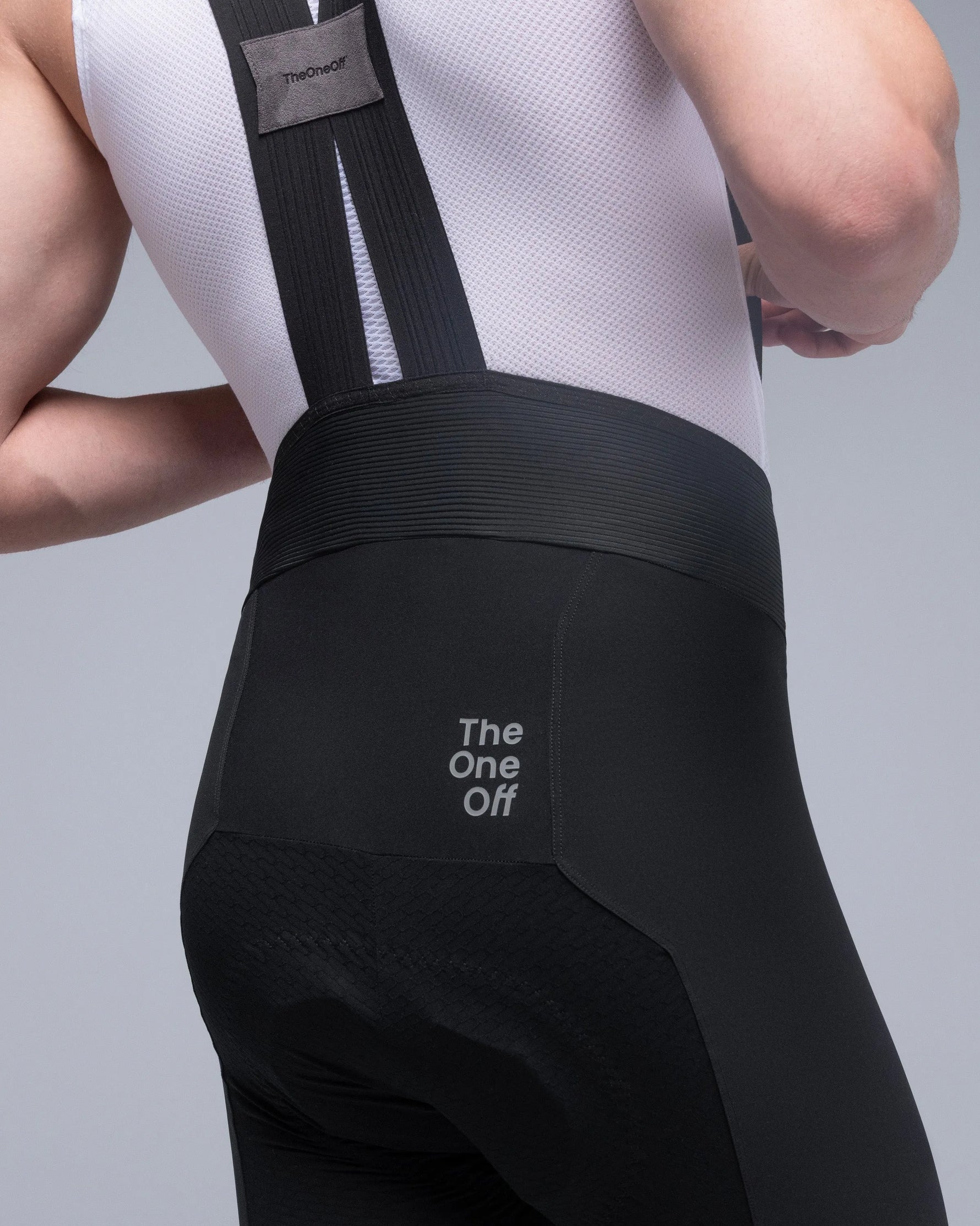 TheOneOff Xenon Bib Short in Future Black, rear view on model showing straps and waistband