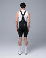 TheOneOff Xenon Bib Short in Future Black shown from rear on male model