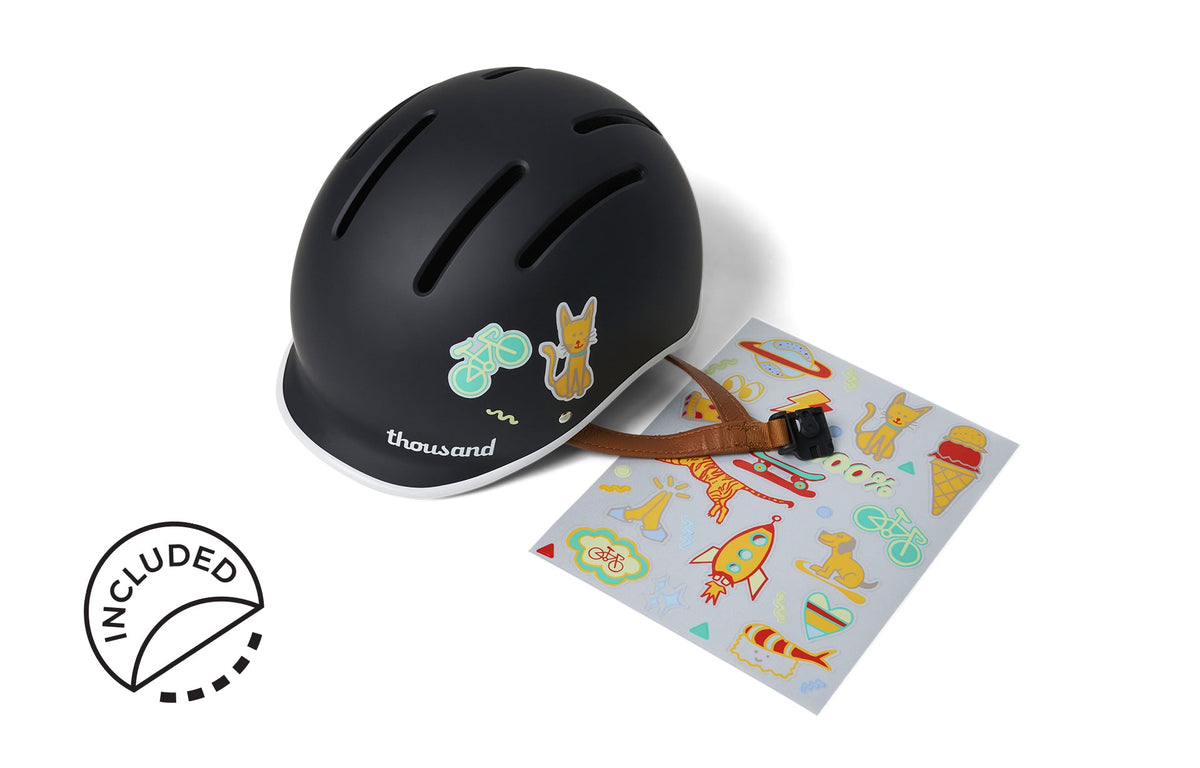 Thousand JR Kids helmet in matte carbon black with included colorful sticker sheet