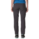 Patagonia Women's Quandary Pants in dark gray shown from back view on model