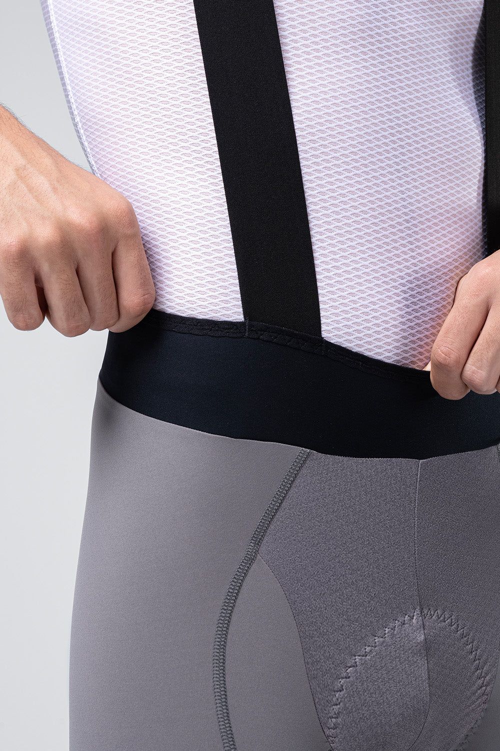 Gobik Absolute 7.0 bib shorts in gray with black straps and white mesh jersey