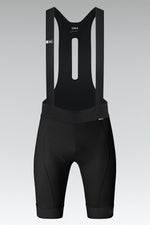 Black Gobik Absolute Compact cycling bib shorts with suspenders on gray background
