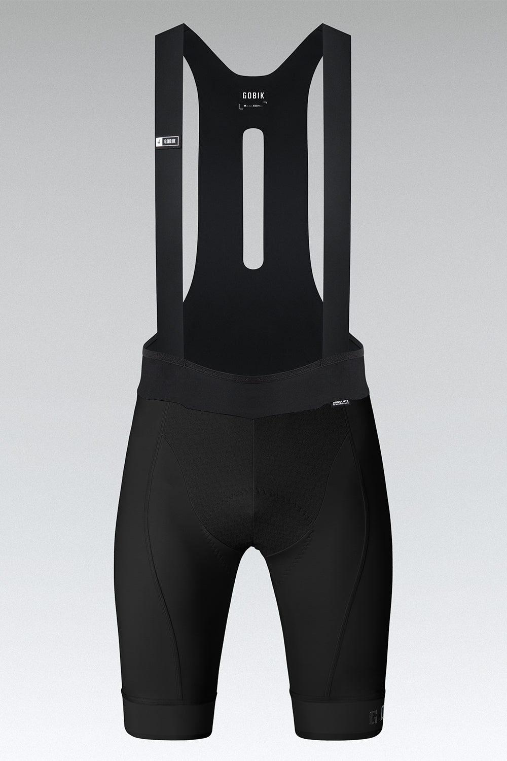 Black Gobik Absolute Compact cycling bib shorts with suspenders on gray background