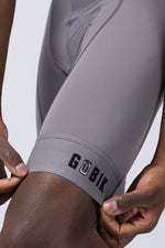 Close-up of Gobik Absolute Compact bib short leg gripper band in gray Kettle colorway