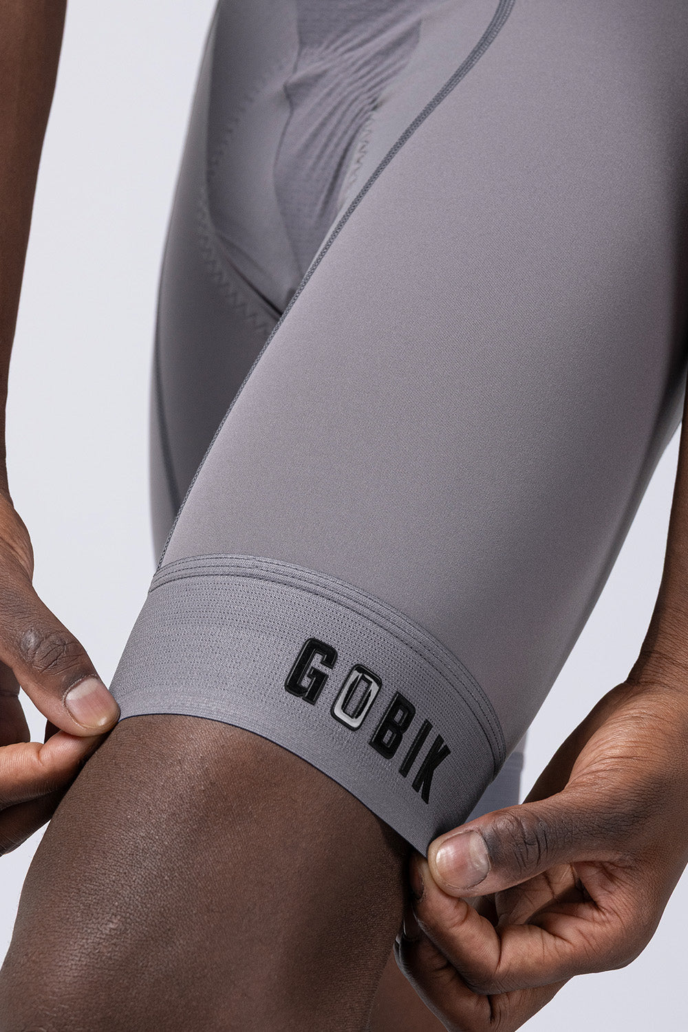 Close-up of Gobik Absolute Compact bib short leg gripper band in gray Kettle colorway