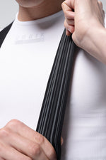 Detail view of Gobik Artic Stride bib strap interior showing striped elastic construction