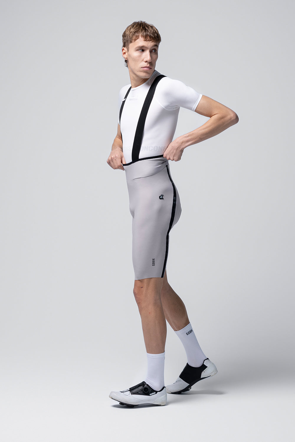 Gobik Artic Stride men's bib shorts tapioca colorway shown from side angle on model