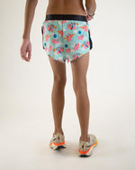 ChicknLegs men's split running shorts with pink flying pig pattern on mint background