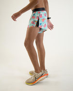 ChicknLegs men's running shorts with flying pigs print in light blue