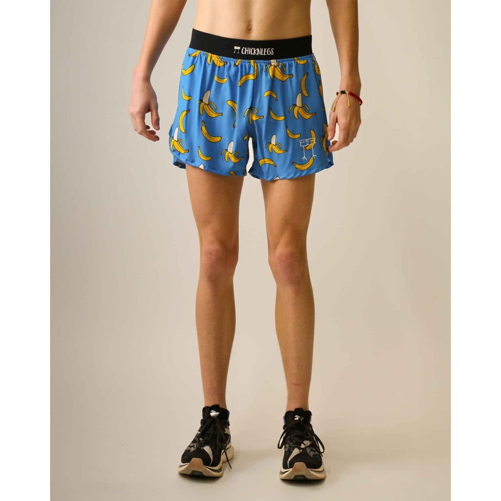 ChicknLegs 4-inch split running shorts in blue banana print pattern on model