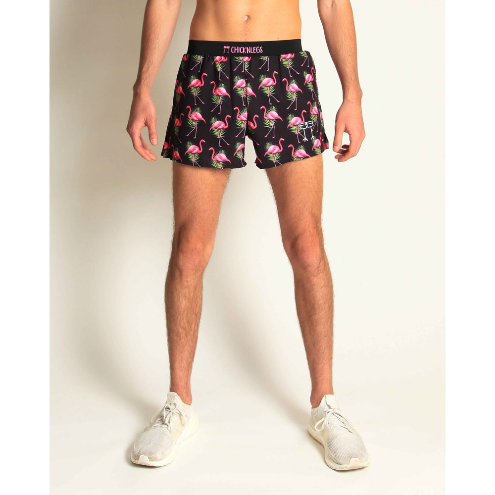 ChicknLegs 4-inch half split running shorts in black flamingo print on male model