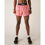 Pink athletic shorts with yellow banana pattern and black waistband on male model