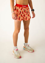 ChicknLegs men's running shorts with cartoon chili pepper pattern on orange background
