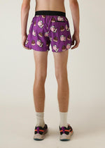 Purple men's shorts with cute cow and chocolate bar pattern, rear view