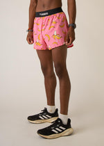 Man wearing pink running shorts with yellow banana print and black waistband