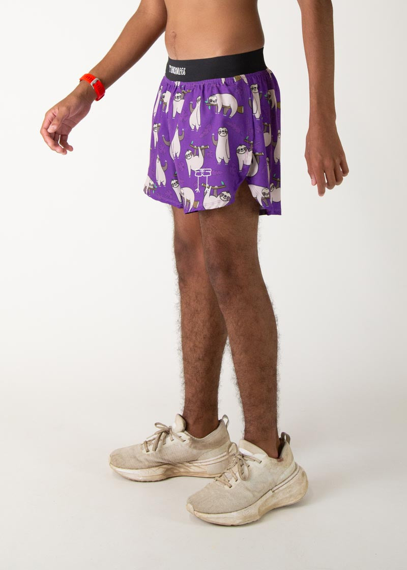 Purple running shorts with sloth pattern and black waistband on male model