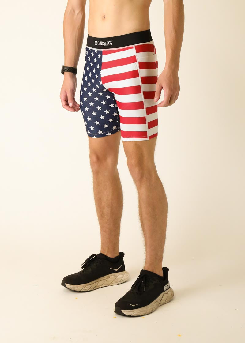 Man wearing ChicknLegs USA flag pattern compression shorts with blue stars and red stripes