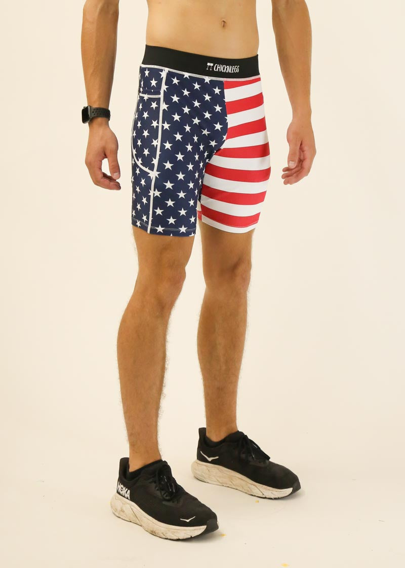 Man wearing ChicknLegs USA flag pattern athletic shorts with stars and stripes design