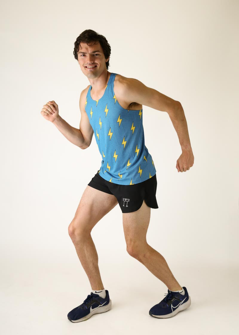 Man wearing blue athletic singlet with yellow lightning bolt pattern