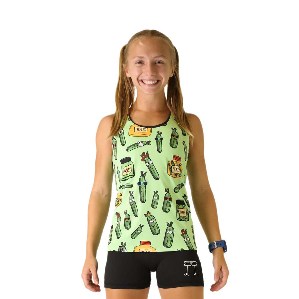 Woman wearing green pickle-patterned athletic singlet with black shorts