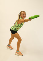 Woman wearing light green ChicknLegs performance singlet with pickle print pattern