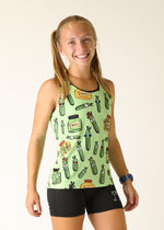 Woman wearing light green athletic singlet with cartoon pickle pattern design
