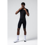 Man wearing black Gobik Integral Hudson cycling bodysuit with short sleeves