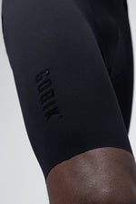 Close-up of black Gobik cycling shorts showing embossed logo detail