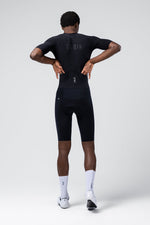 Gobik Integral Hudson Solid men's cycling suit in black, rear view on model