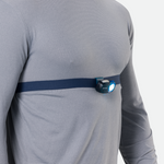 Nathan Luna Fire chest light with blue LED illuminated, worn across torso with strap