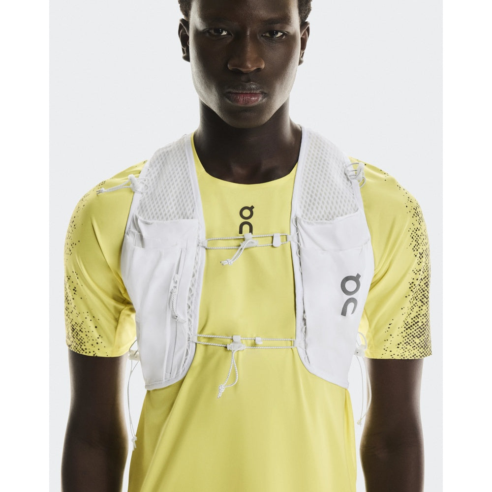 On Ultra Vest Pro Unisex in white worn over yellow On running shirt by male model