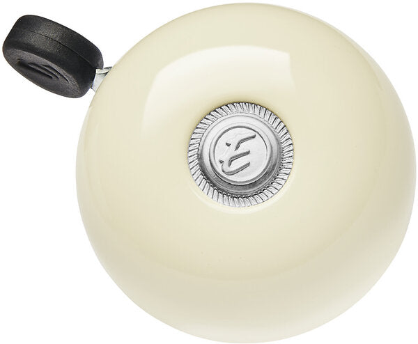 Electra bicycle bell in cream color with silver center and black striker