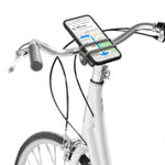 Nite Ize HandleBand Universal Smartphone Bar Mount in black mounted on white bicycle handlebars